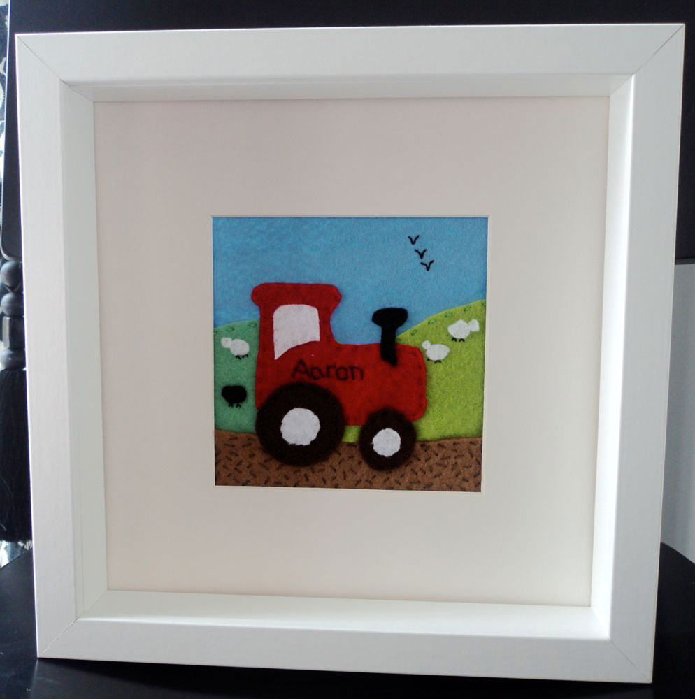 Felt Box Frame — Mounted. Hand cut felt tractor personalised with the name Aaron a 10 inch squared box frame, mounted so that the picture is 4½ inches square. Detail is hand cut and hand stitched by me and is very labour intensive. This is just an example of the pictures I can do. Prices for these start at £20 depending on the size of the picture and the level of detail required. Felt Box Frame — Mounted. Hand cut felt tractor personalised with the name Aaron a 10 inch squared box frame, mounted so that the picture is 4½ inches square. Detail is hand cut and hand stitched by me and is very labour intensive. This is just an example of the pictures I can do. Prices for these start at £20 depending on the size of the picture and the level of detail required.