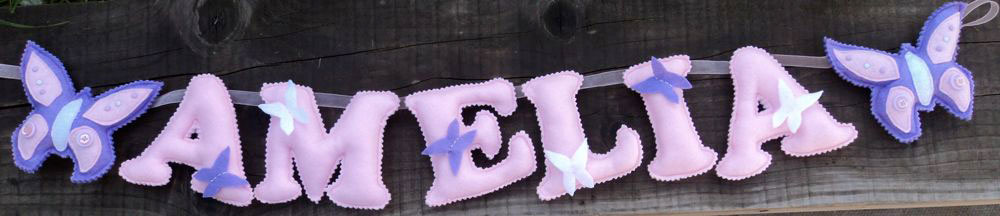 Star Name Banner in Pinks / Purple. £12 for up to four letters, each additional letter is £2. This one is priced at £14. Each shape is 3½ inches tall and usually the same width. These can be done in any combination of colours. Butterfly Name Banner- in pink, lilac and white. £16 for up to three letters (this includes the butterfly’s at either end, so the two butterfly’s plus three letters). £2 for each additional letter. This one is priced at £22. Each of the letters are 4½ inches tall — the length of the banner will depend on the letters used (as some letters are wider than others) and the number of letters required. These can be done in any combination of colours.